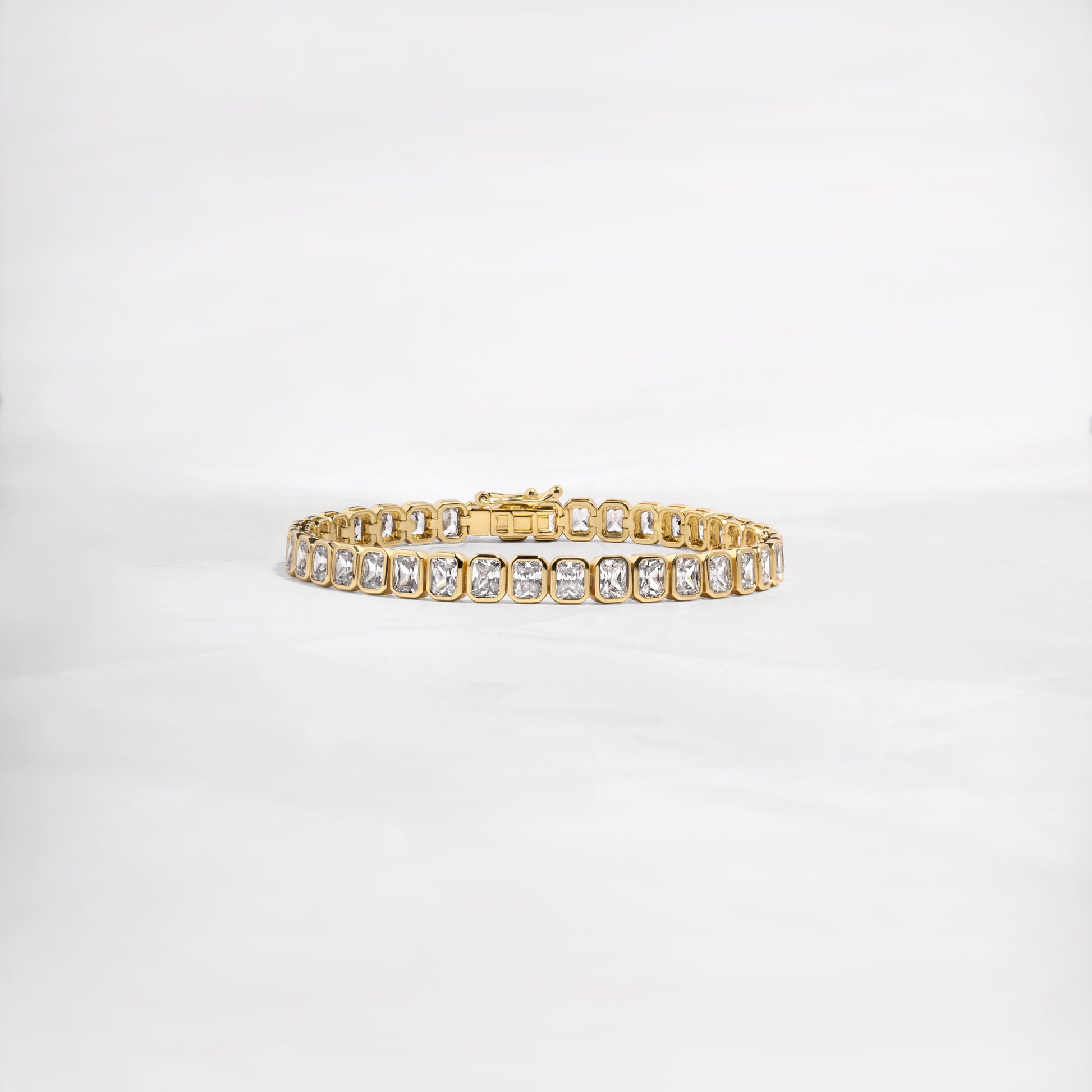 Gold emerald cut diamond tennis bracelet by Sami Jewels