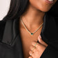 Birthstone Choker Necklace in Emerald on model smiling, wearing other dainty gold rings