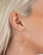 gold hoop earrings on model 40mm model 