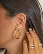 Gold hoop earrings from Sami Jewels, The Madi Hoops, featuring classic circular design and a polished finish.