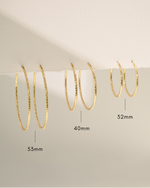 gold hoop earring sizing infographic on neutral background 