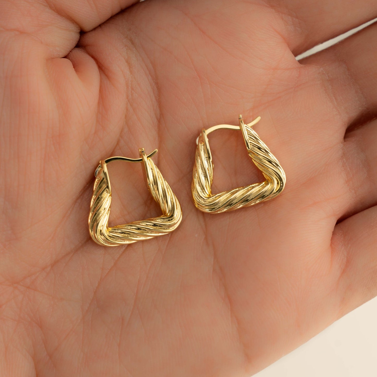 Statement triangle hoop earrings in gold