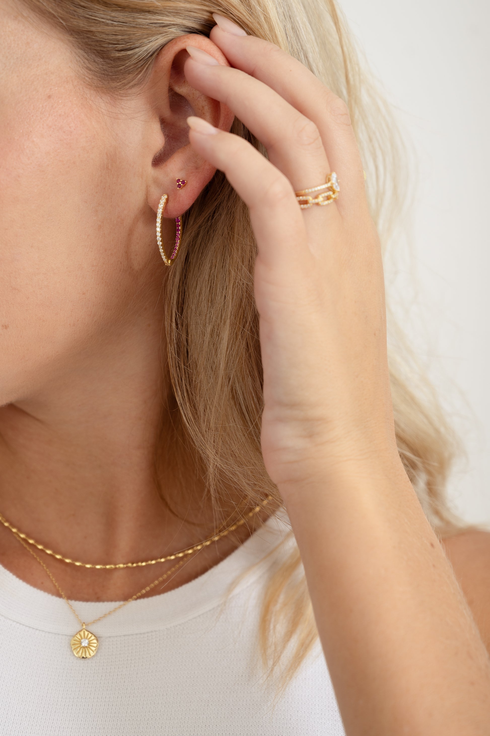 gold hoop earrings with ruby detailing 