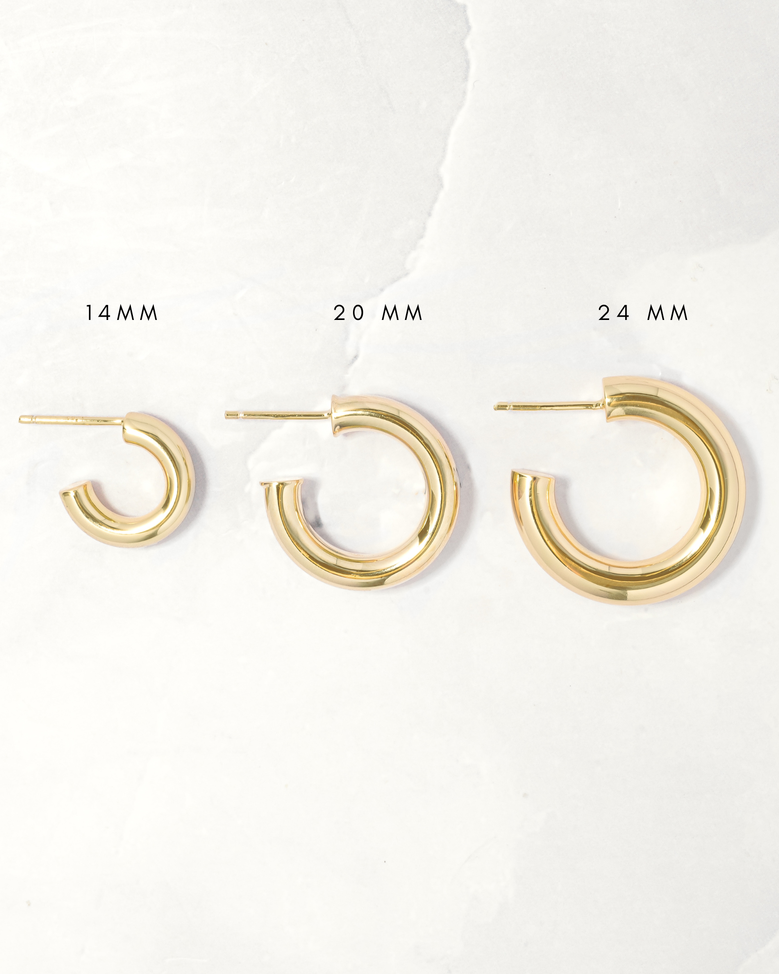 chunky tube hoop earrings in gold in multiple sizes