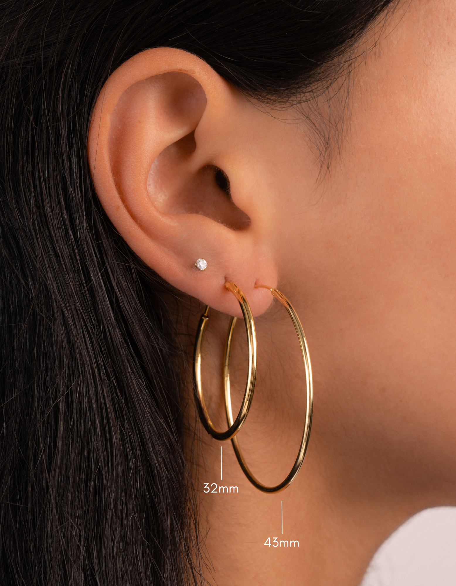 gold 32mm and 43mm infinity hoops on model
