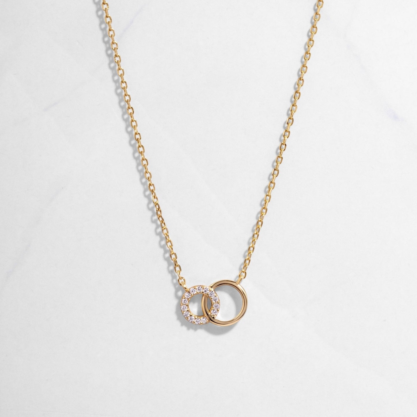 Gold Eternity Circle Necklace on white background