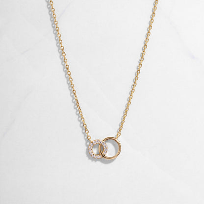 Gold Eternity Circle Necklace on white background