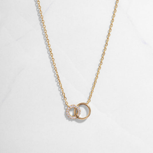 Gold Eternity Circle Necklace on white background