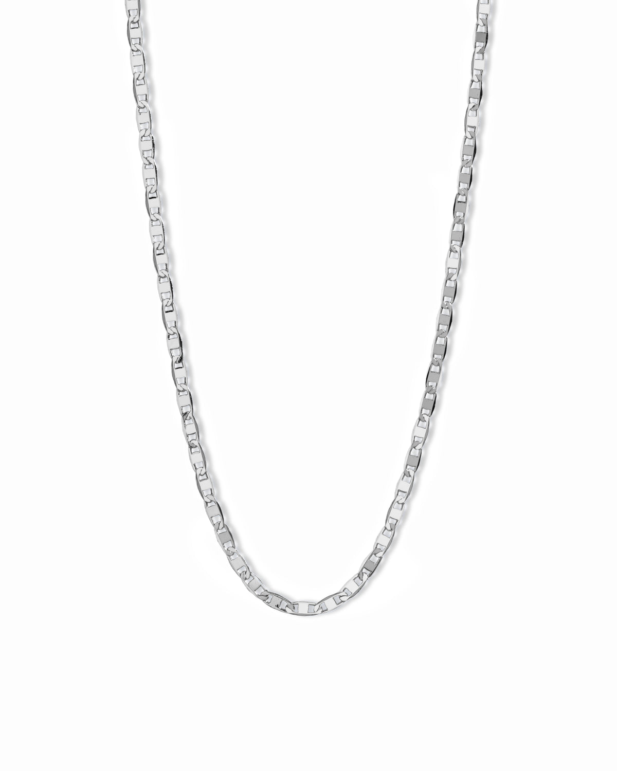Gold mariner link chain necklace laid flat on white