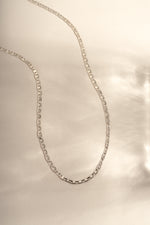 Detail of flat oval mariner links with center bar, view 2