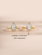 Gold Bezel Marquise Ring with Baguette Band by Sami Jewels, featuring a marquise-shaped centerpiece and baguette accents.