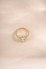 Gold marquise ring with baguette band, showcasing elegant diamond cuts, from Sami Jewels, viewed from the top.