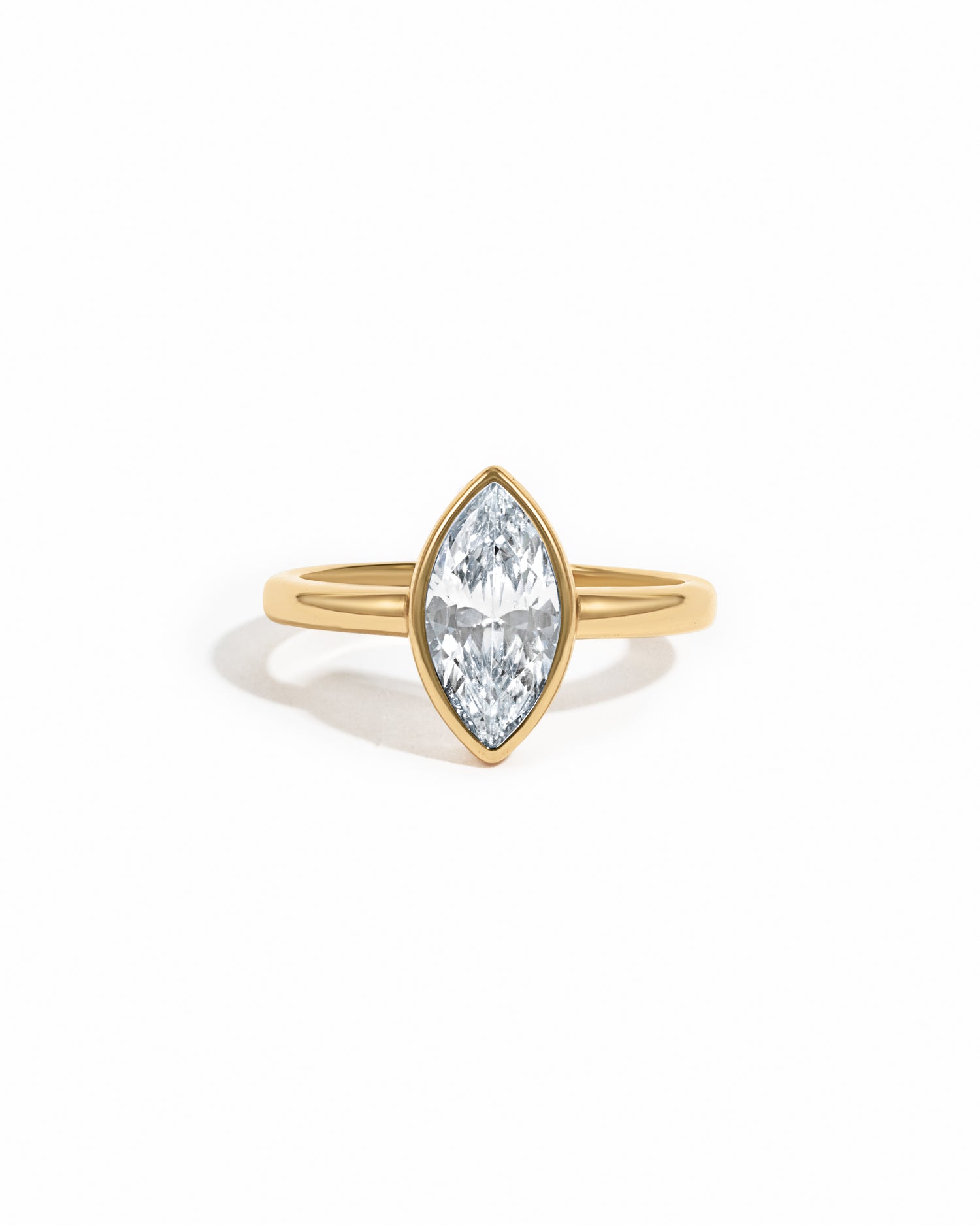 Gold Bezel Marquise Ring by Sami Jewels featuring a marquise-cut gemstone set in a sleek gold band