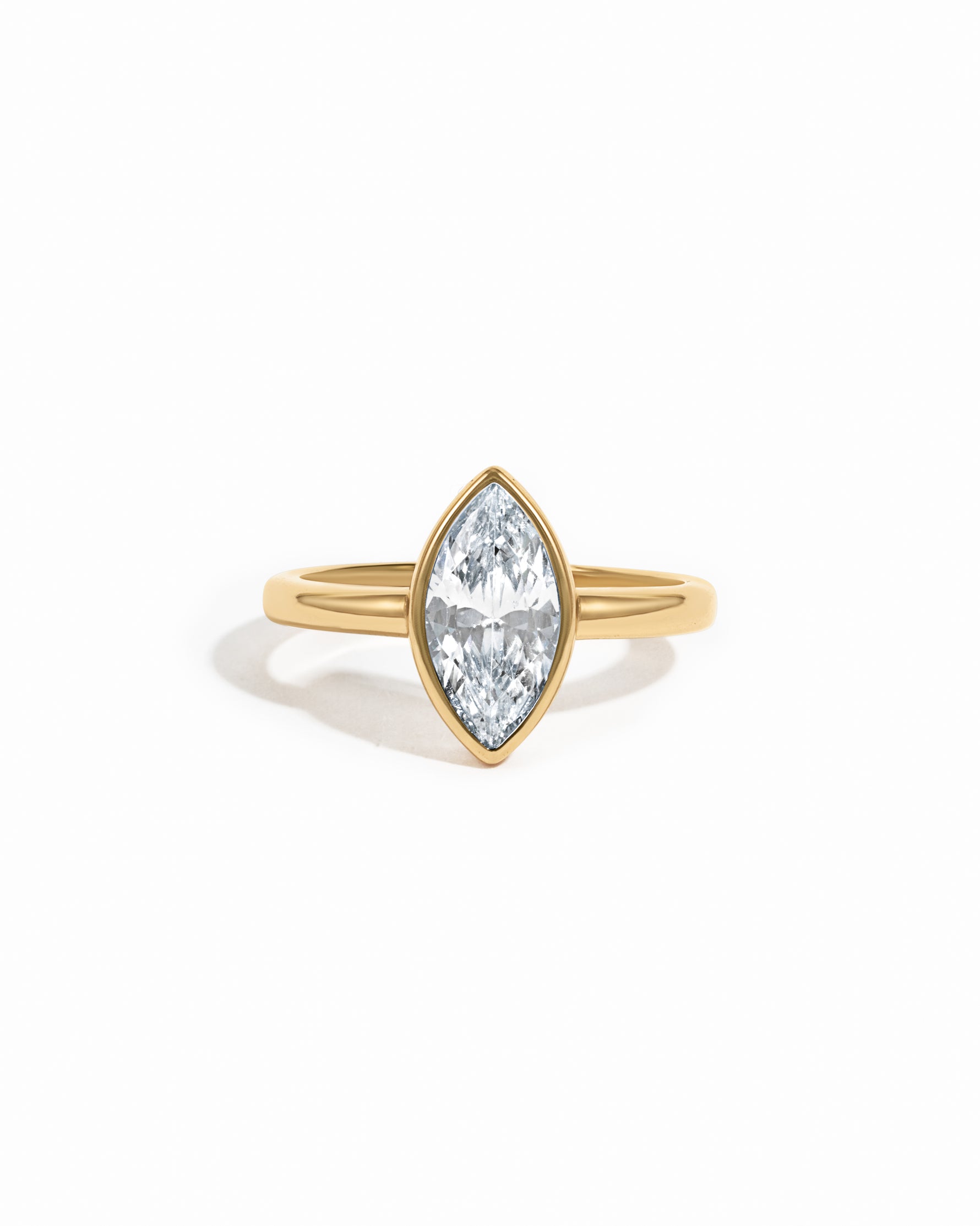 Gold Bezel Marquise Ring by Sami Jewels featuring a marquise-cut gemstone set in a sleek gold band