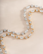 Sami Jewels gold and silver Marquise and Round Stone Diamond Tennis Bracelets displayed side by side.