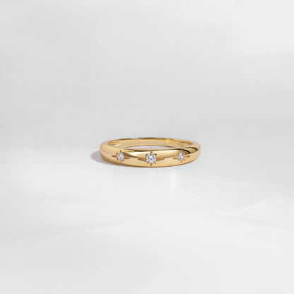 Gold minimalist Diamond Ring with Star Setting on white background