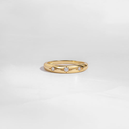 Gold minimalist Diamond Ring with Star Setting on white background