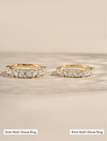 5mm gold multistone ring compared to a 4mm gold multi stone ring on a neutral background