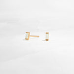 closeup image of opal birthstone earrings