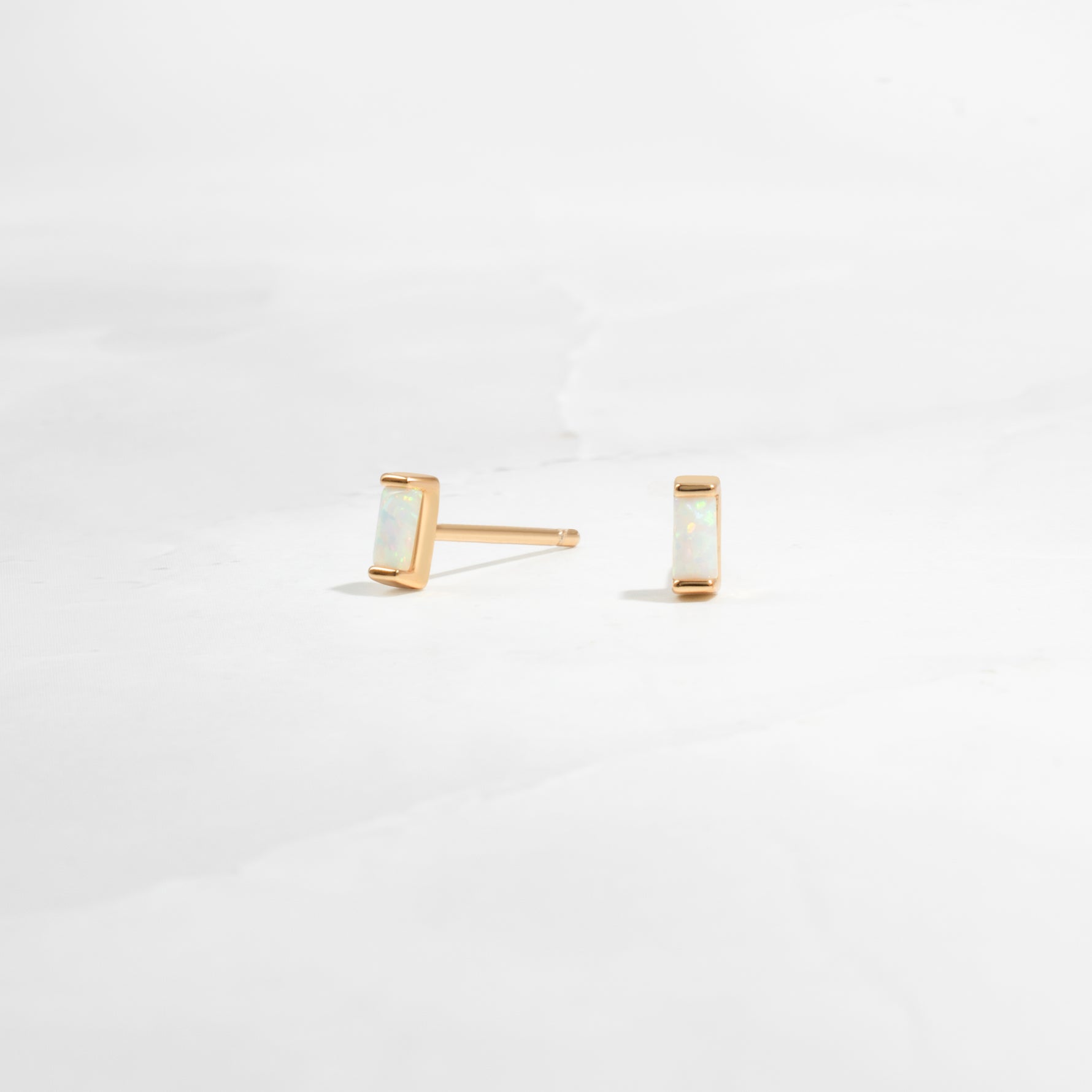 closeup image of opal birthstone earrings