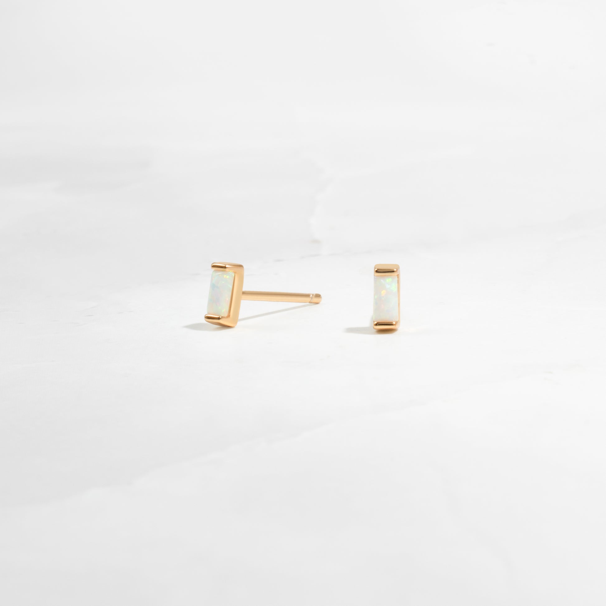 closeup image of opal birthstone earrings