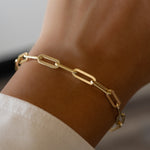 gold paperclip bracelet on model