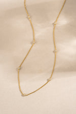 gold pave beaded necklace neutral background