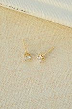 gold 5x7mm diamond pear stud earring profile neutral background 