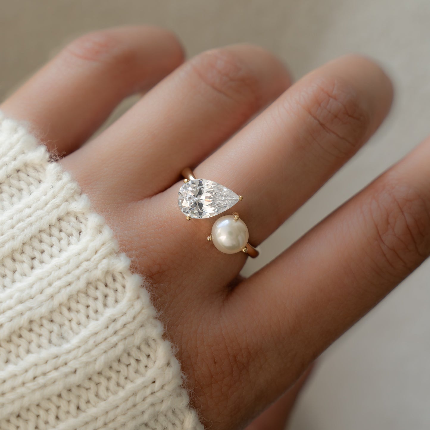 A model wearing a Pearl Ring with Toi et Moi design.