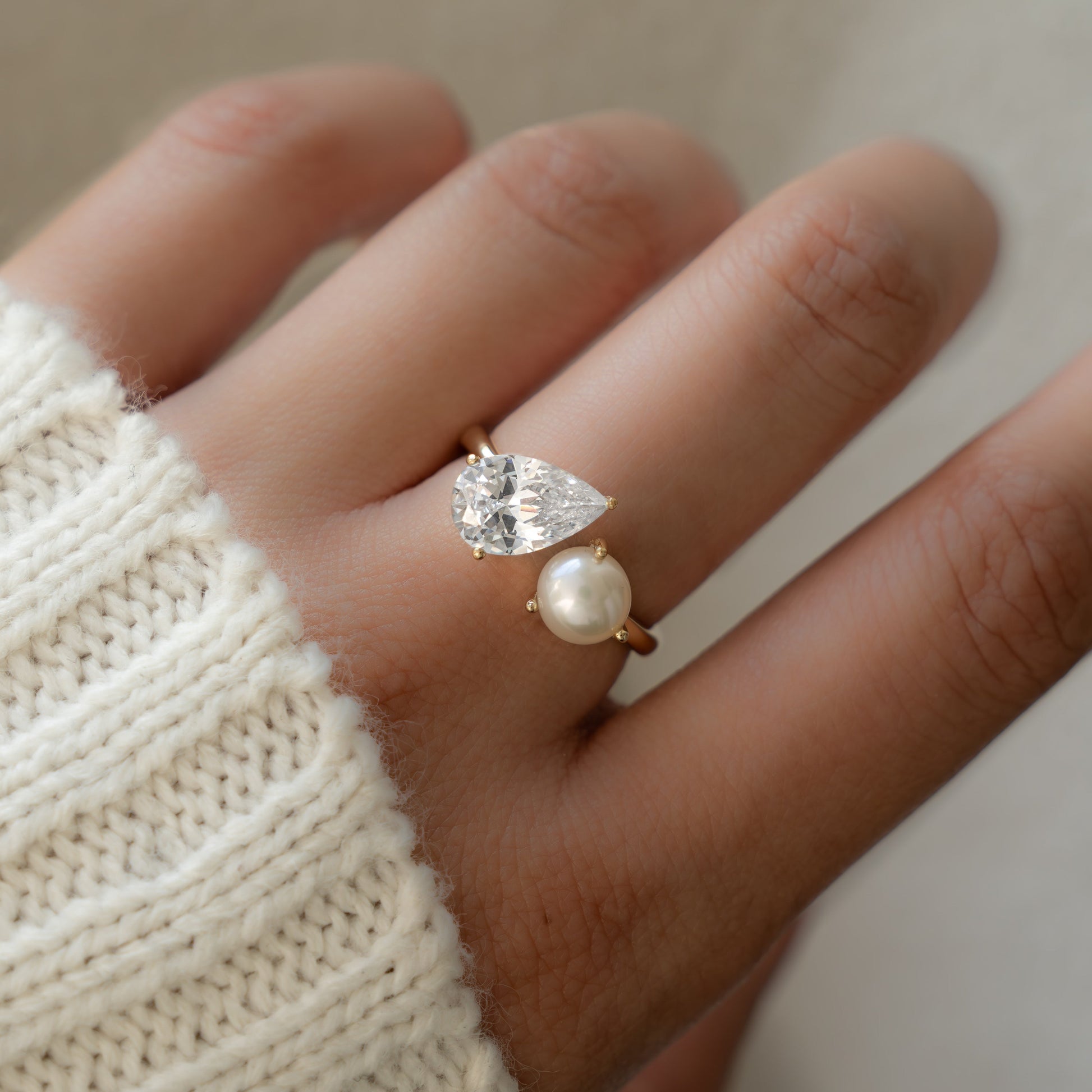 A model wearing a Pearl Ring with Toi et Moi design.