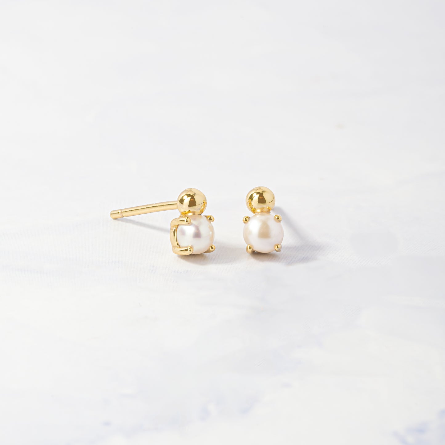 dainty gold pearl stud earrings