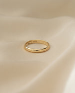Gold 3mm plain band ring from Sami Jewels, showcasing a sleek, smooth front view of the minimalist jewelry piece.
