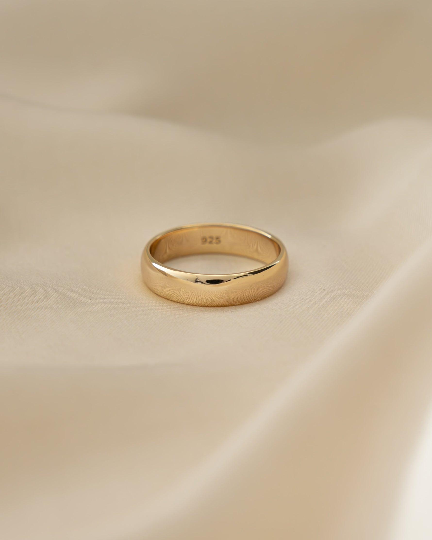 Gold 5mm plain band ring by Sami Jewels, showcasing a smooth, polished gold wedding or fashion ring on a neutral background.