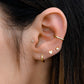 model wearing gold earring stack with plain ear cuff