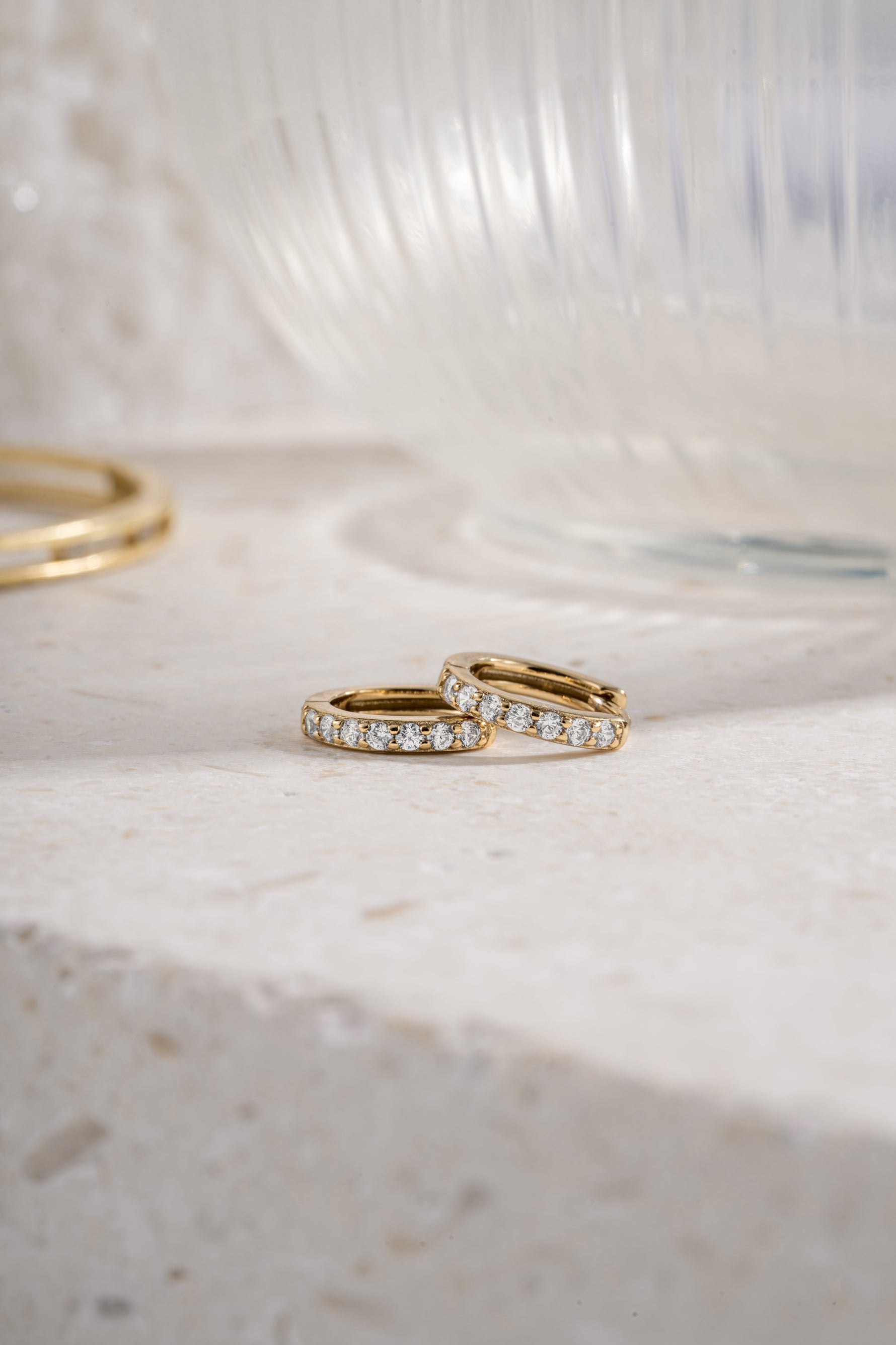 gold plated 10mm diamond studded huggie earrings side view