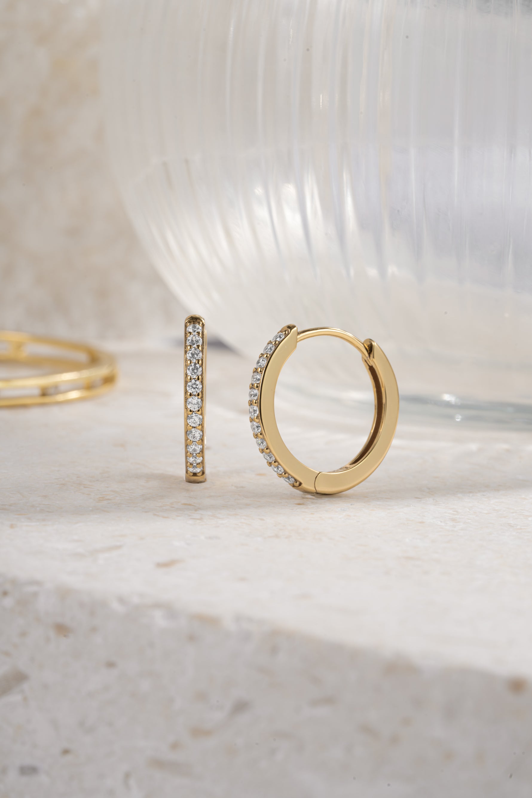 gold plated 16mm studded huggies neutral background