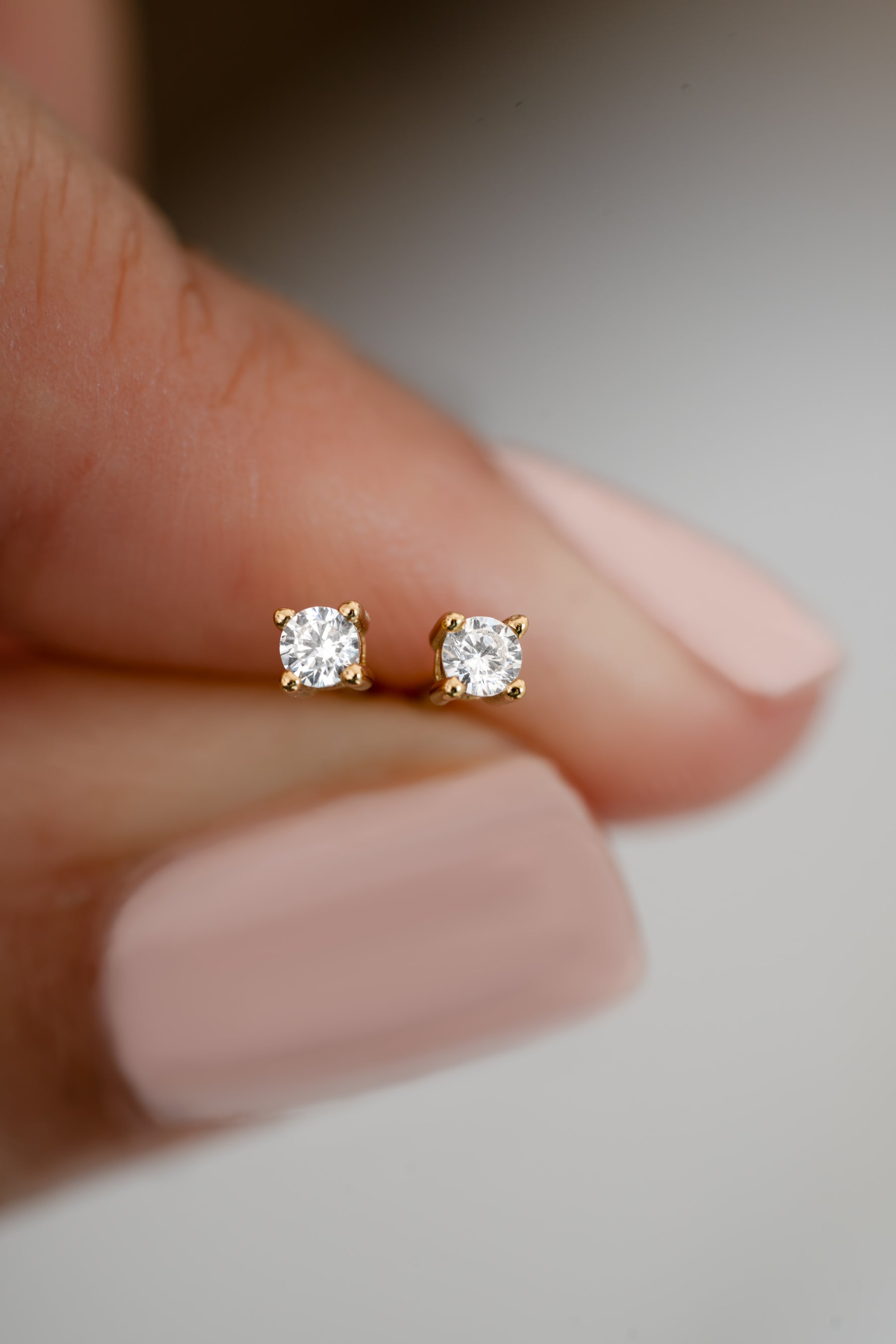 Gold plated 2.5mm diamond stud earrings closeup view