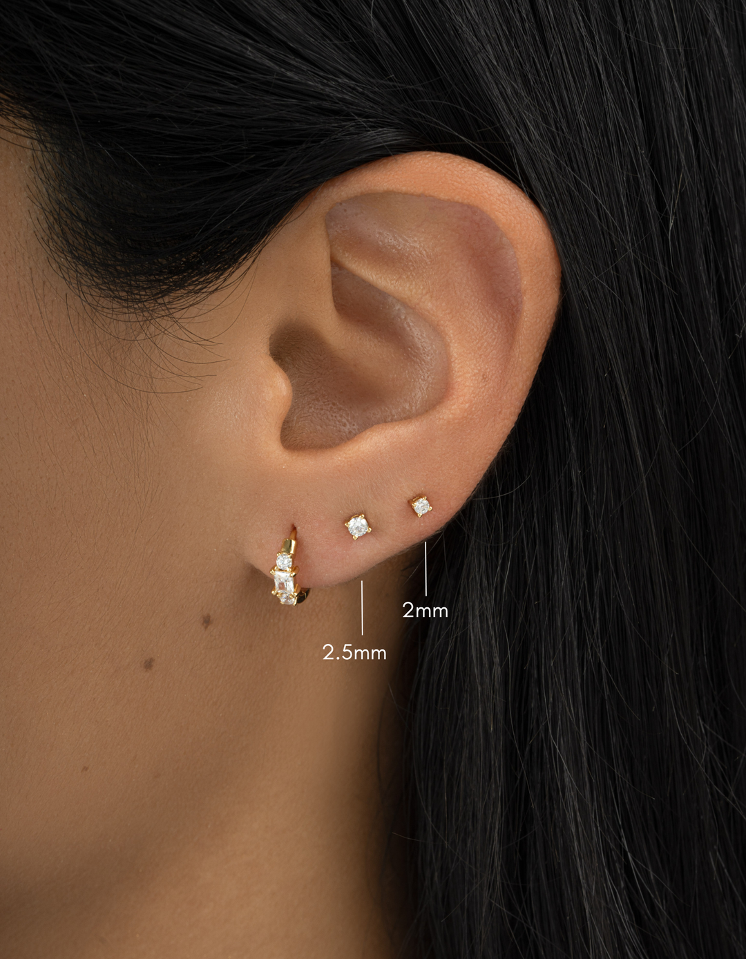 Gold-plated 2.5mm diamond solitaire stud earrings by Sami Jewels featuring a classic, minimalist design.