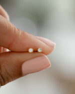 gold plated 2.5mm small diamond studs closeup view