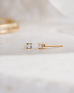 gold plated 2mm diamond solitaire stud earring side view white background