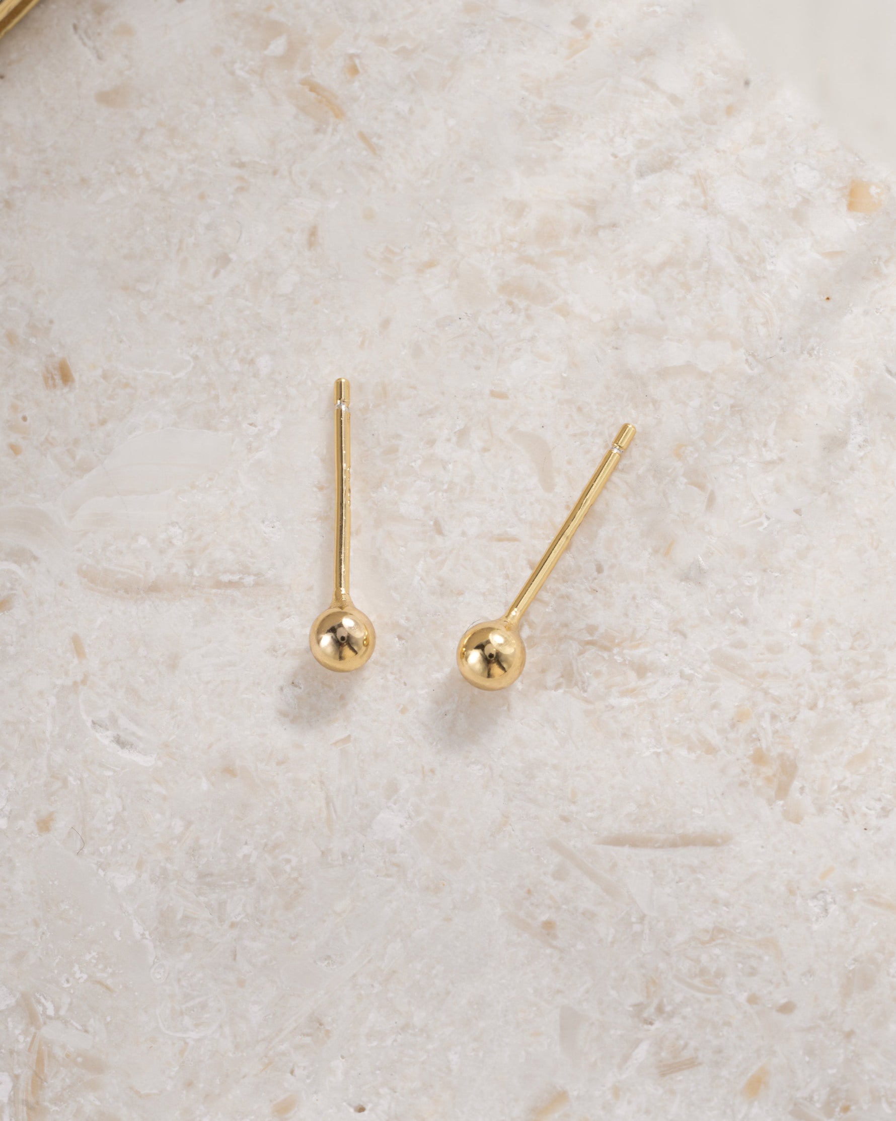 gold 3mm ball stud earrings top view