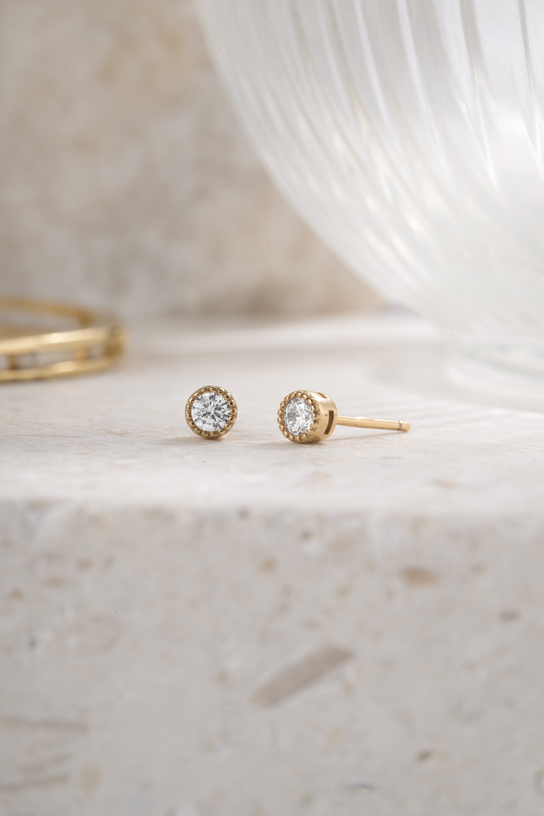 gold plated 4mm diamond studs neutral background