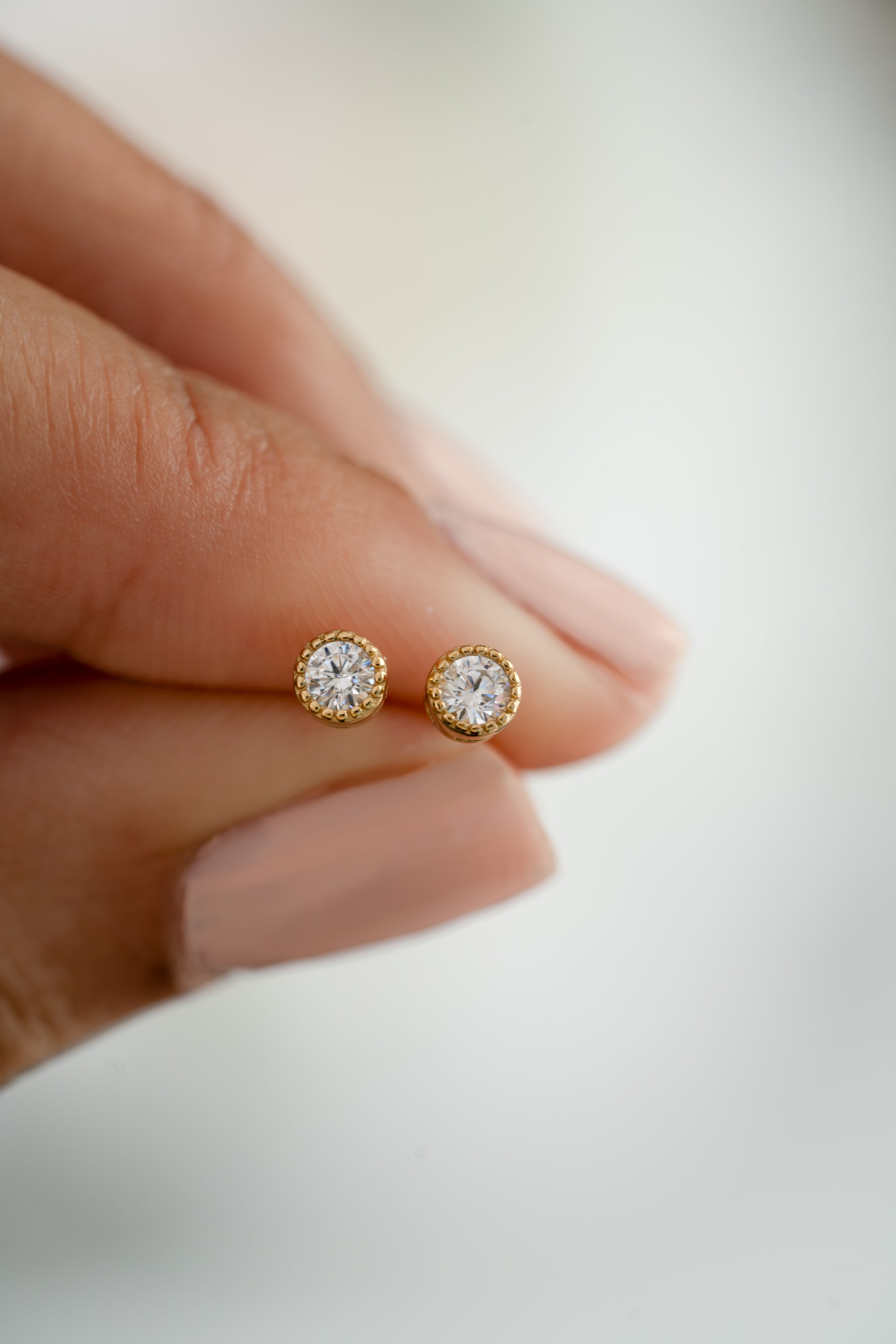 gold plated 4mm diamond stud earring stone detail close up view