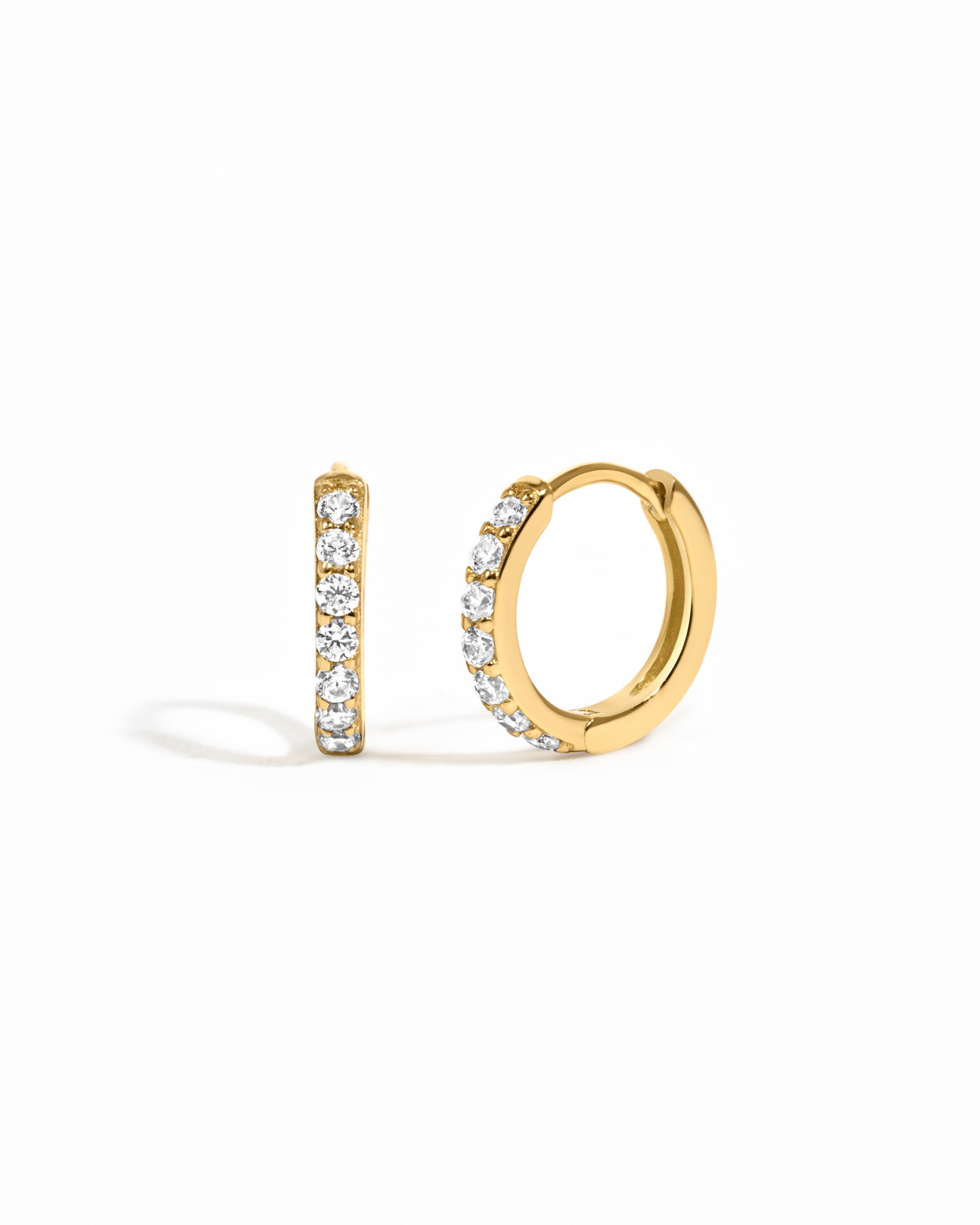 gold  8mm diamond huggie hoop on a white background