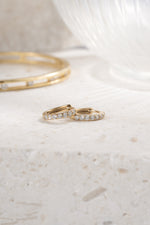 gold plated 8mm huggie earring closeup side view