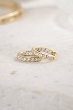 gold plated studded huggies stone detail