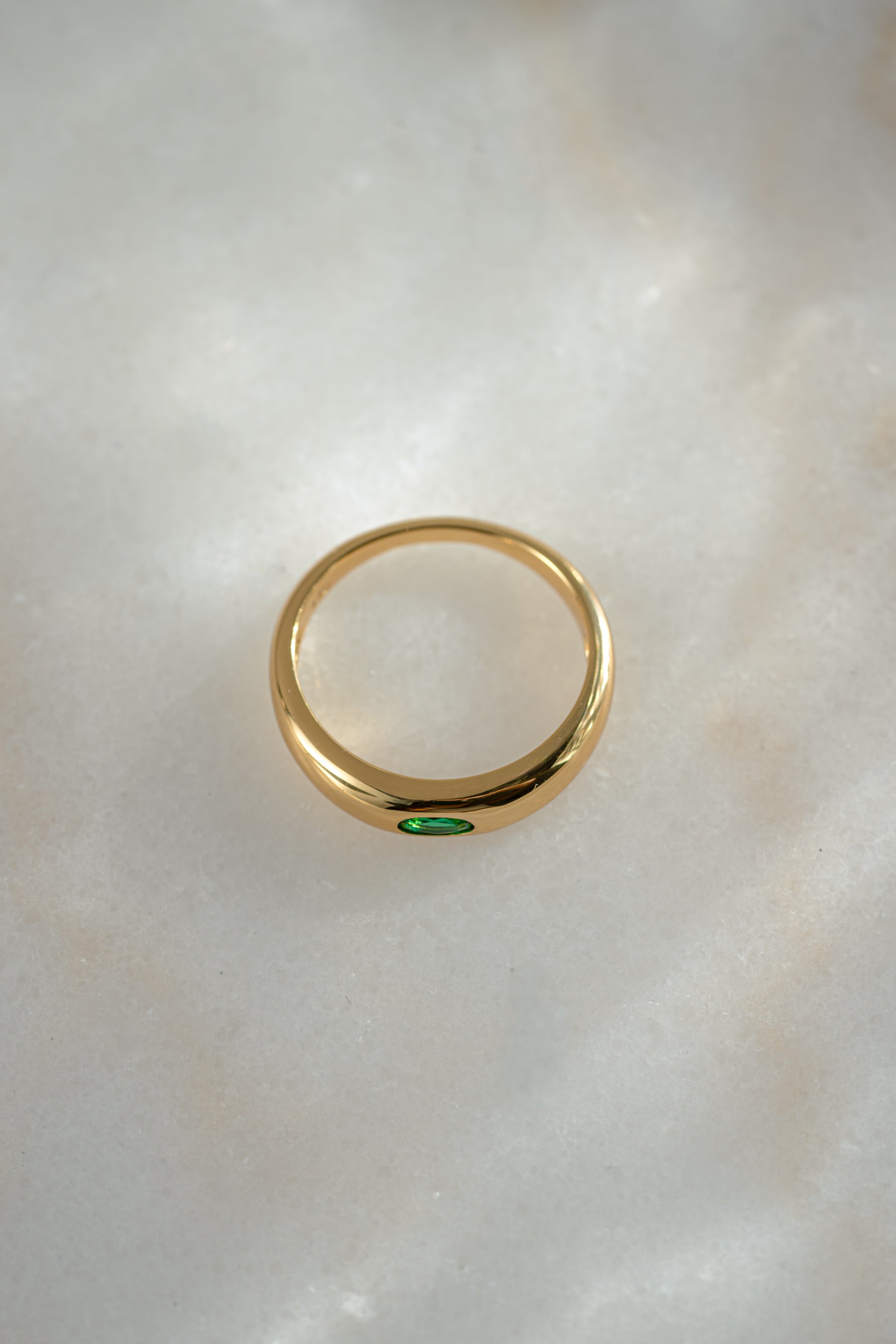 gold emerald bezel set dome ring top view 