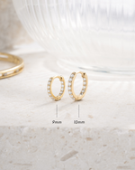 gold plated in and out studded hugggie hoops in different sizes, one 9mm and one 10mm  