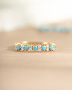 gold turquoise and opal stacking ring closeup