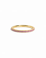 gold rose October birthstone eternity ring white background